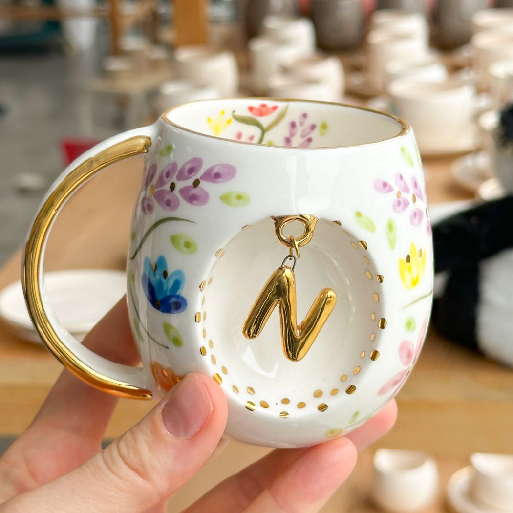 Porcelain letter mug with gold handle and N letter charm, floral spring blossom design