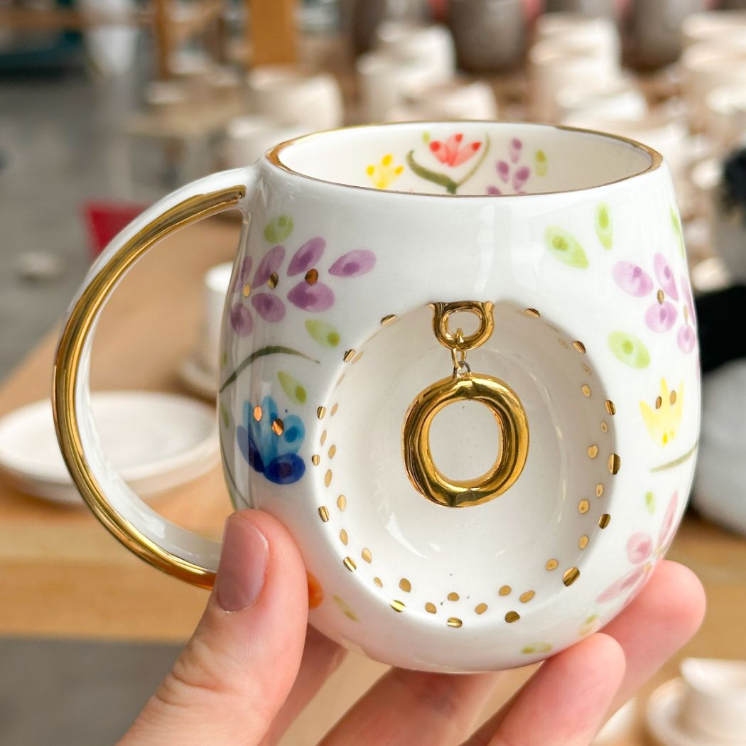 Porcelain letter mug with gold handle and O letter charm, floral spring blossom design
