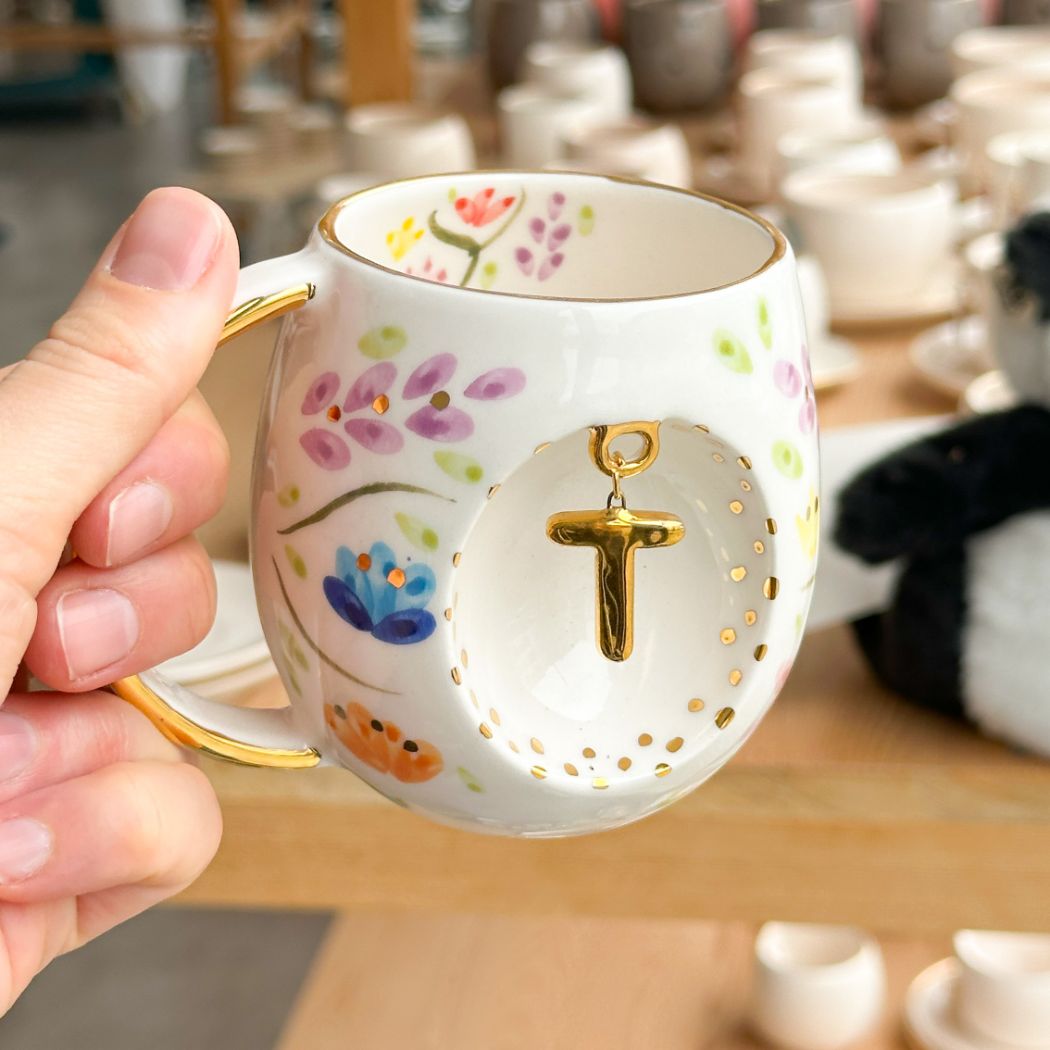 Porcelain letter mug with gold handle and T letter charm, floral spring blossom design