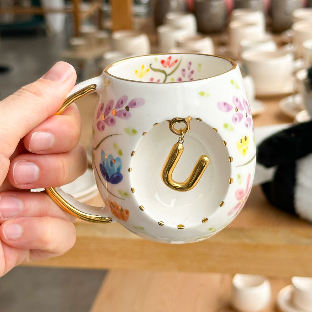 Porcelain letter mug with gold handle and U letter charm, floral spring blossom design