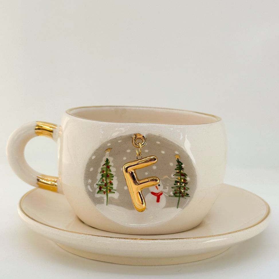 Porcelain tea cup on saucer with F letter gold charm, winter trees and snowman