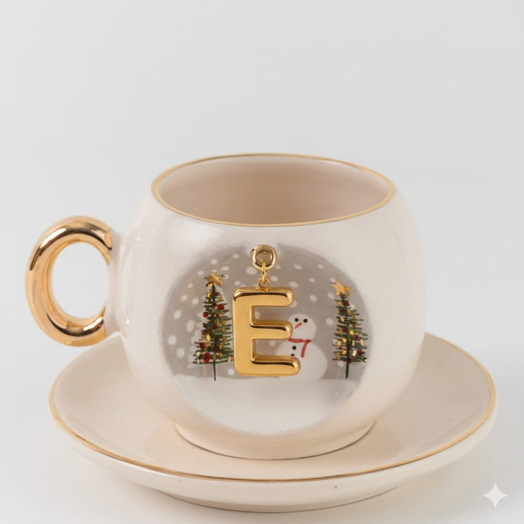 Porcelain coffee cup and saucer set, gold handle, letter E holiday ornament