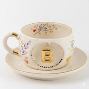 Porcelain letter mug and saucer with floral trim and gold B medallion