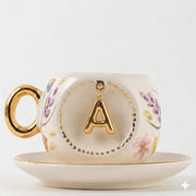 Porcelain Turkish coffee cup and saucer set with gold handle and letter A in gold frame