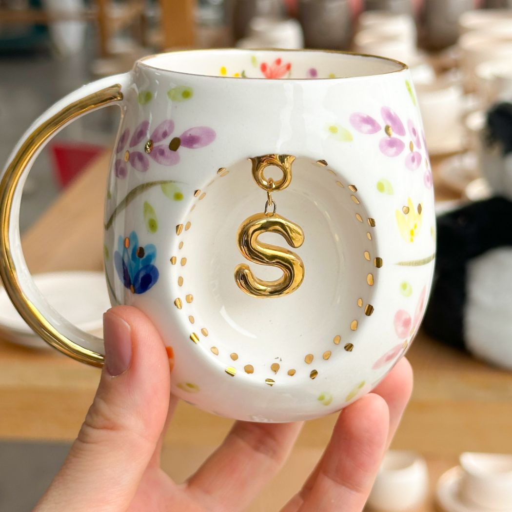 Porcelain letter mug with gold handle and S letter charm, floral spring blossom design