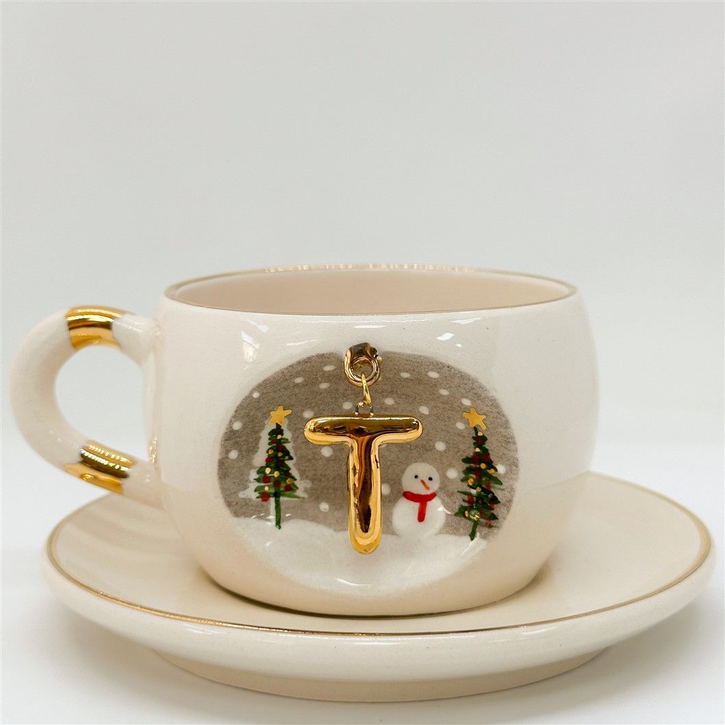 Porcelain tea cup and saucer, white with gold letter, trees and snowman, 160 ml.