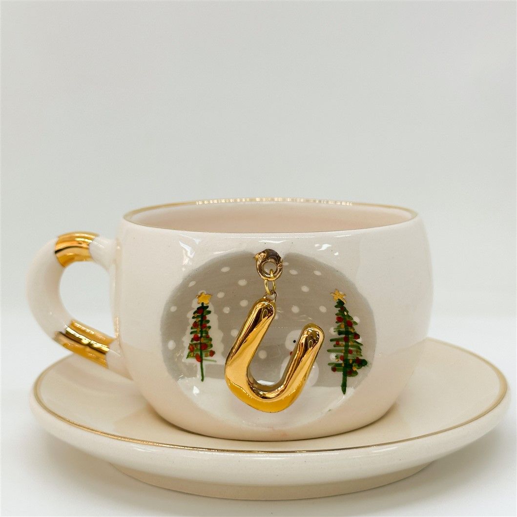 Porcelain tea cup and saucer set, white cup with gold letter, trees and snowman, 160 ml.