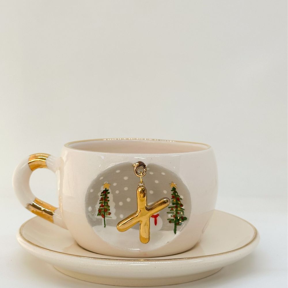Porcelain tea cup and saucer set, white with gold letter, trees and snowman, 160 ml.
