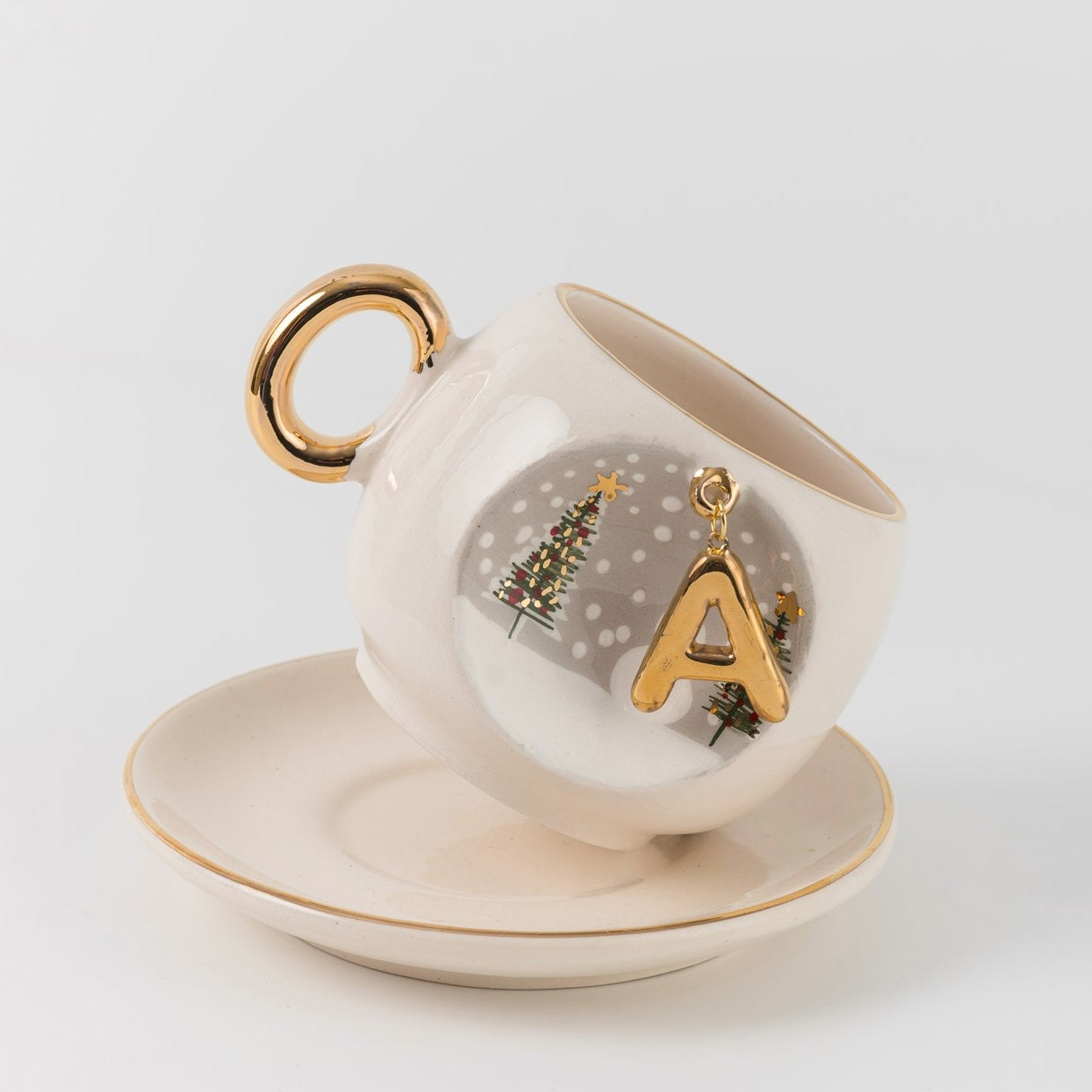 Porcelain coffee cup and saucer set, gold handle, letter A holiday ornament