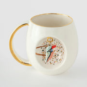 Porcelain mug, gold rim and handle, blue kingfisher bird motif on white