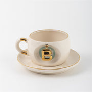Cream tea mug set with gold letter B charm and saucer, Nile green accents