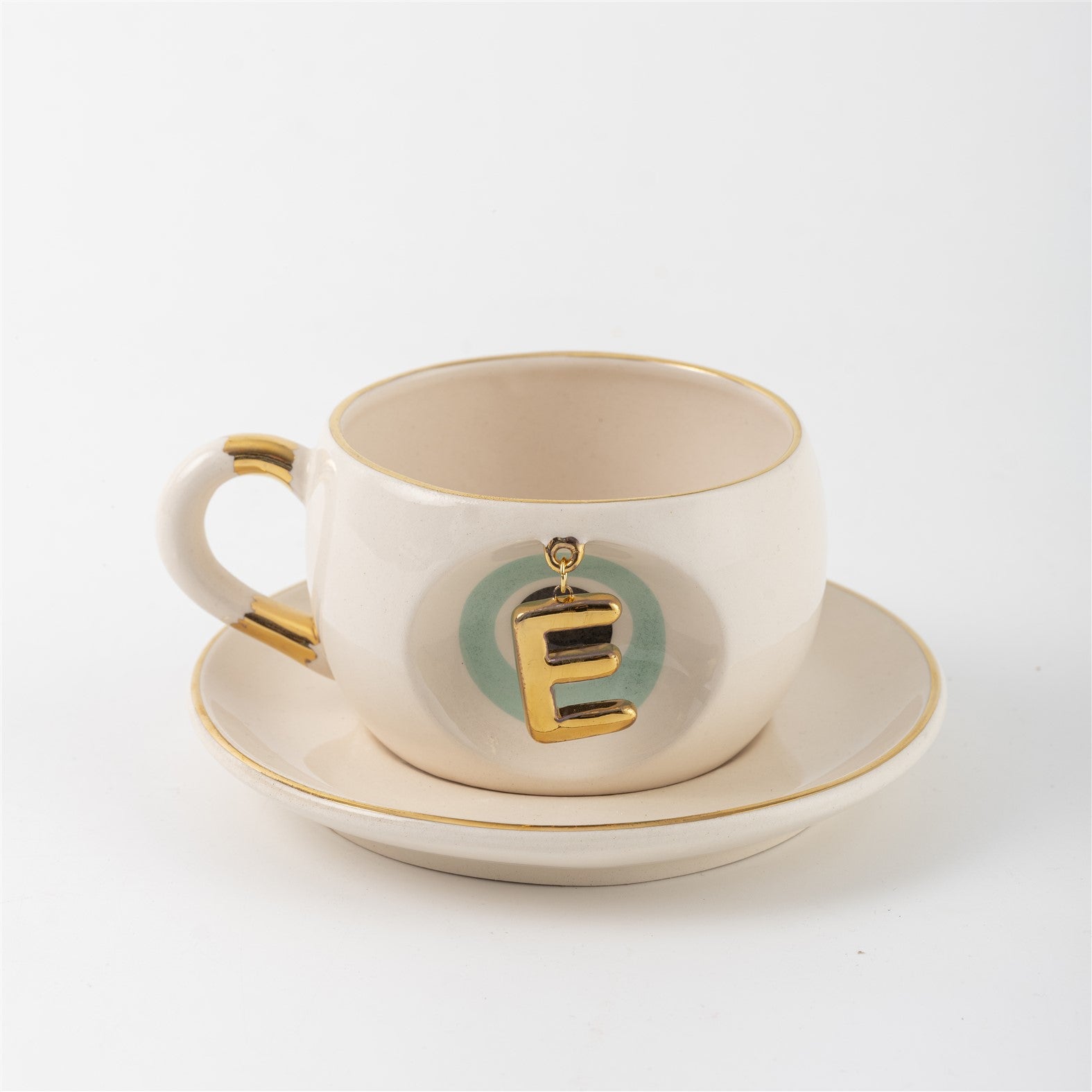Cream tea mug set with gold letter E charm and saucer, Nile green accents
