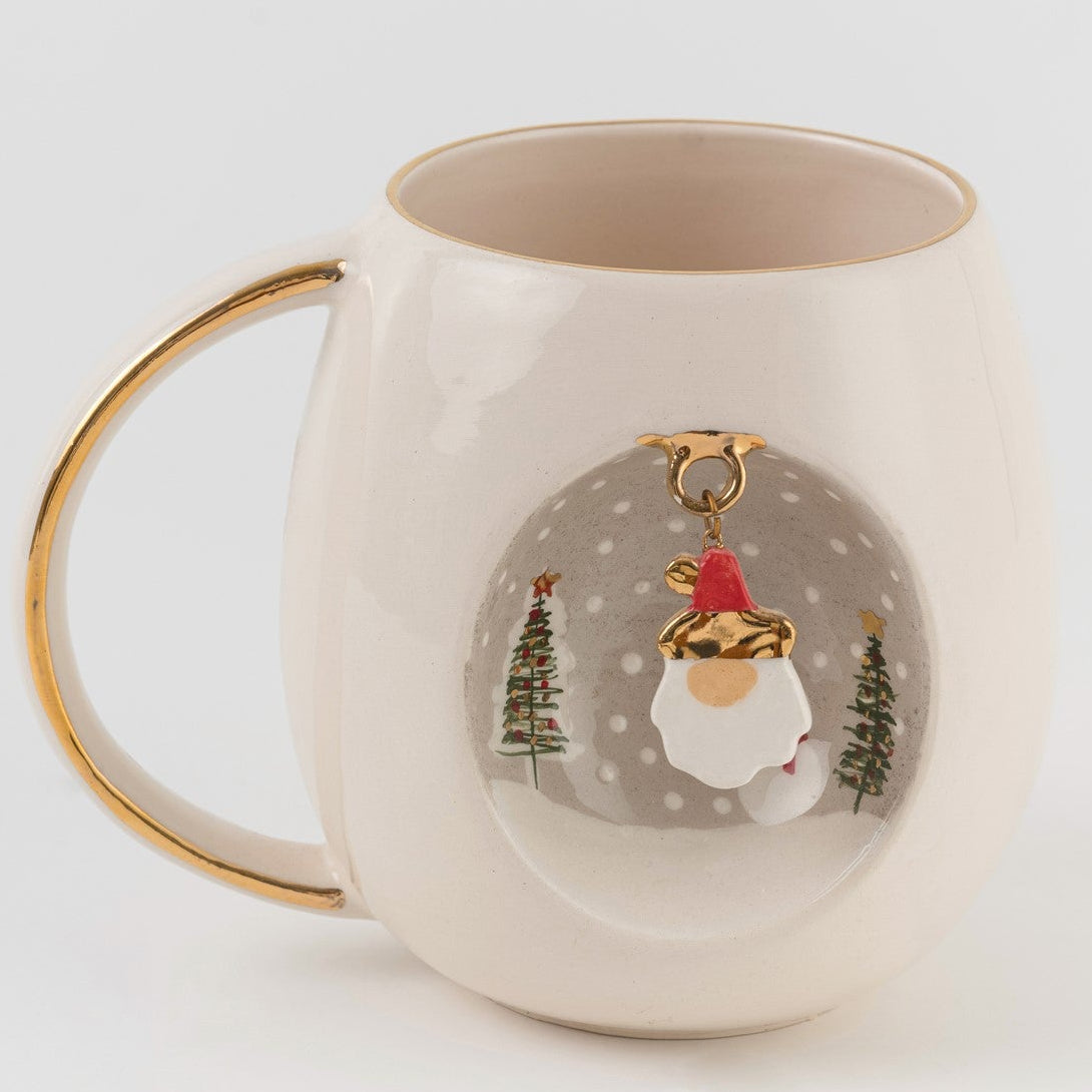 White ceramic mug with gold handle, Father Christmas illustration inside a round scene