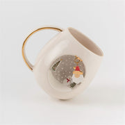 White ceramic mug with gold handle, Father Christmas design on side