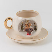 White deer coffee cup and saucer with gold rim, festive reindeer illustration