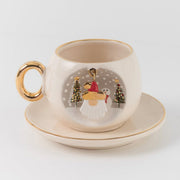 Ceramic coffee cup and saucer with gold trim, Father Christmas ornament scene decal