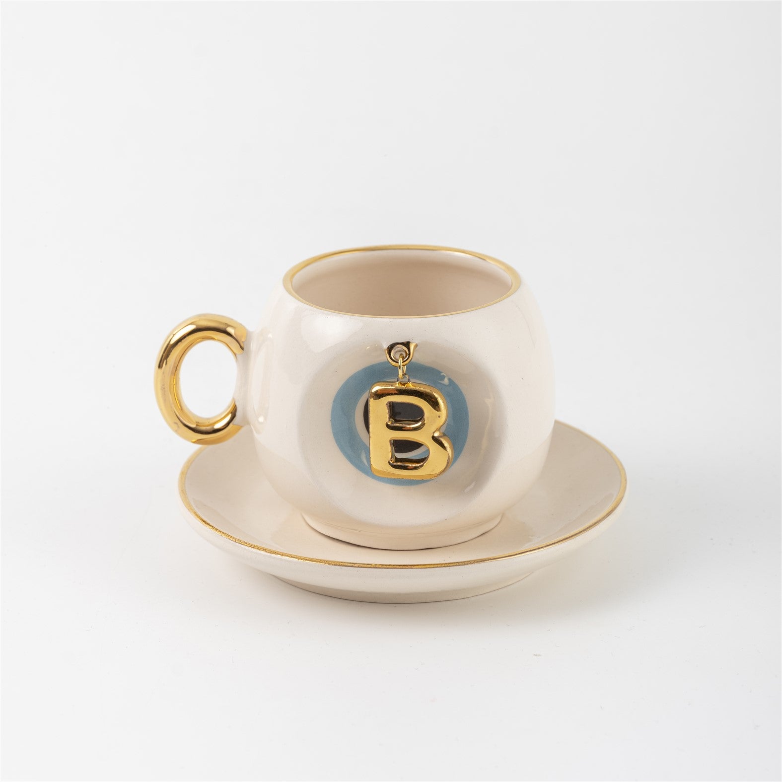 Ceramic Turkish coffee cup and saucer with gold handle, blue letter B charm