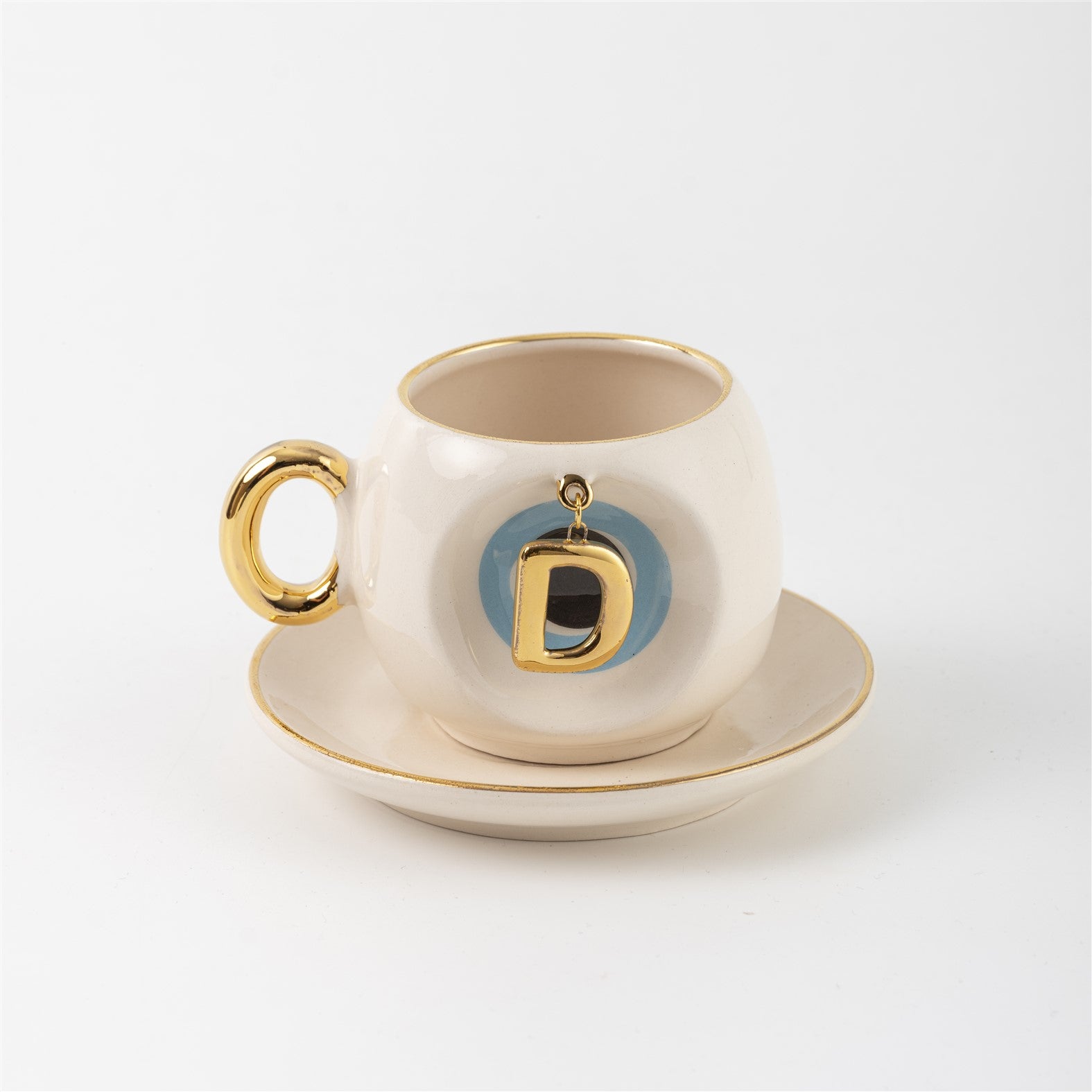 Ceramic Turkish coffee cup and saucer with gold handle, blue letter D charm