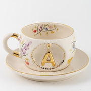 Porcelain letter mug with saucer, gold A charm and spring floral pattern