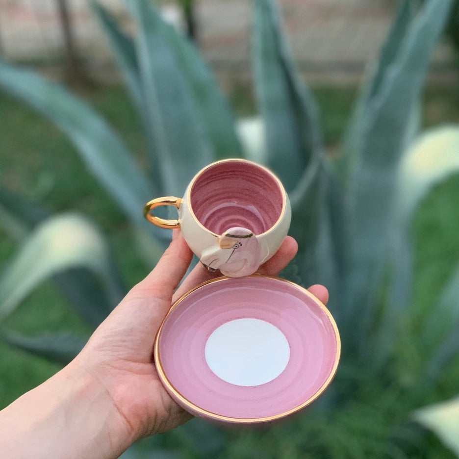 Pink flamingo coffee cup and saucer, top view with swirl interior